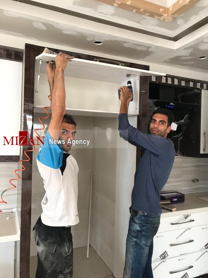 کارگری دارنده مدال نقره بازی‌های آسیایی جاکارتا در ساختمان+ تصاویر